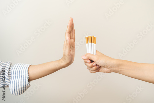 Quit smoking, stop smoke, addiction asian young woman, girl refusing cigarette, smoker quitting smoke, hand in refuse, deny tobacco. Quit bad habit, health care concept. Willpower lifestyle of people.