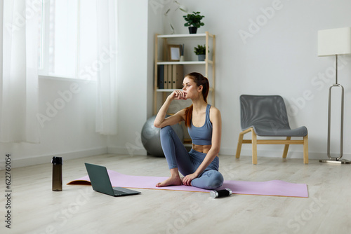 woman lotus home lifestyle health yoga room training video mat laptop