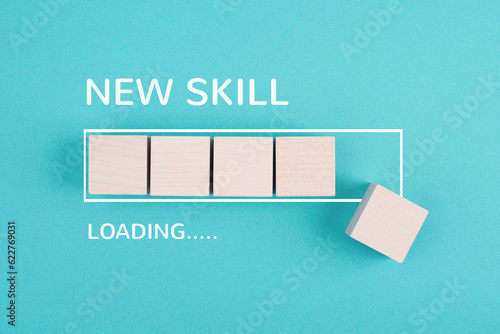 Progress bar with the words new skill loading, education concept, having a goal, online learning, knowledge is power strategy
 photo