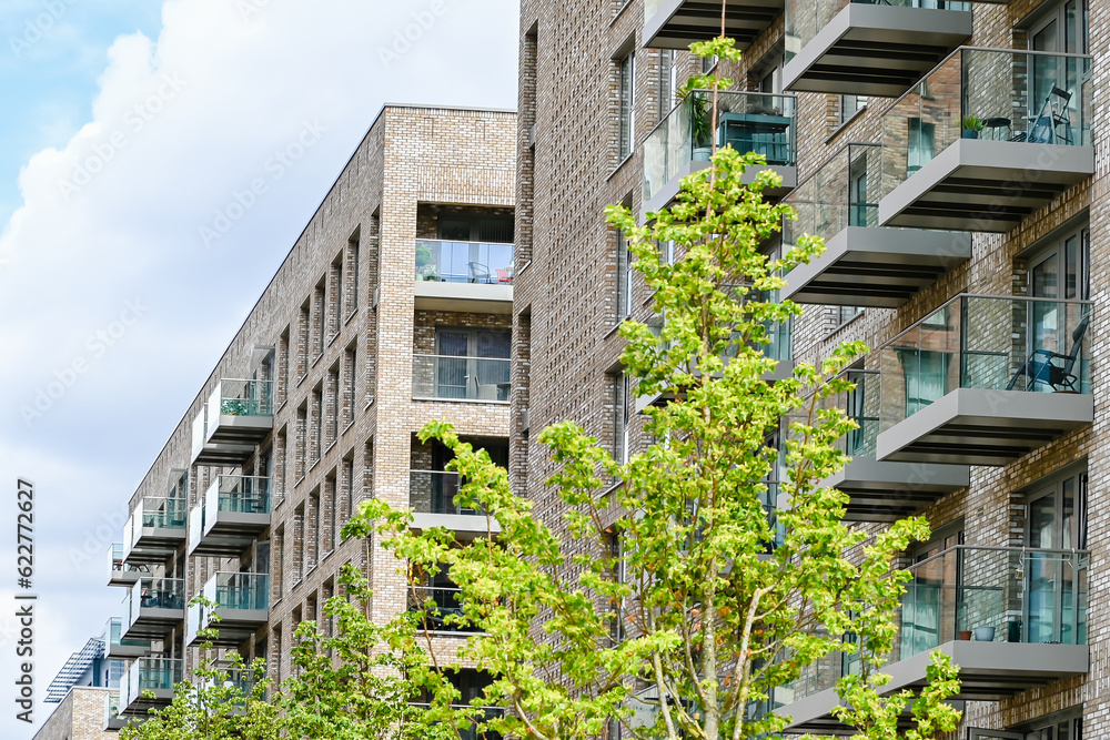 London, UK, 11 July 2023: Modern apartment building with balconies and blue sky at Green Street development in London
London, UK, 11 July 2023: Modern apartment building with balconies and blue sky at Green Street development in London