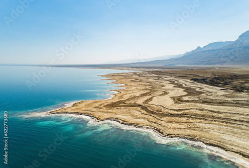Aerial view of the texturized expanding shoreline in the Dead sea as the water level decreases. Negev, Israel. photo