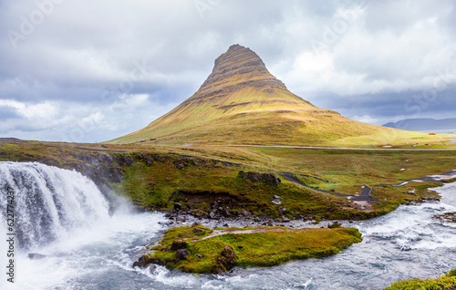 panoramic view of iconic kirkjufell mountain in iceland with waterfall in foreground