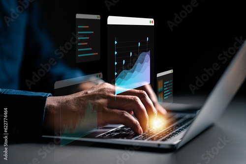 business, statistic, investment, progress, management, financial, graph, analysis, finance, technology. Businessman Typing on Laptop Keyboard to View Graph and Line HUD to Data Analysis for Management