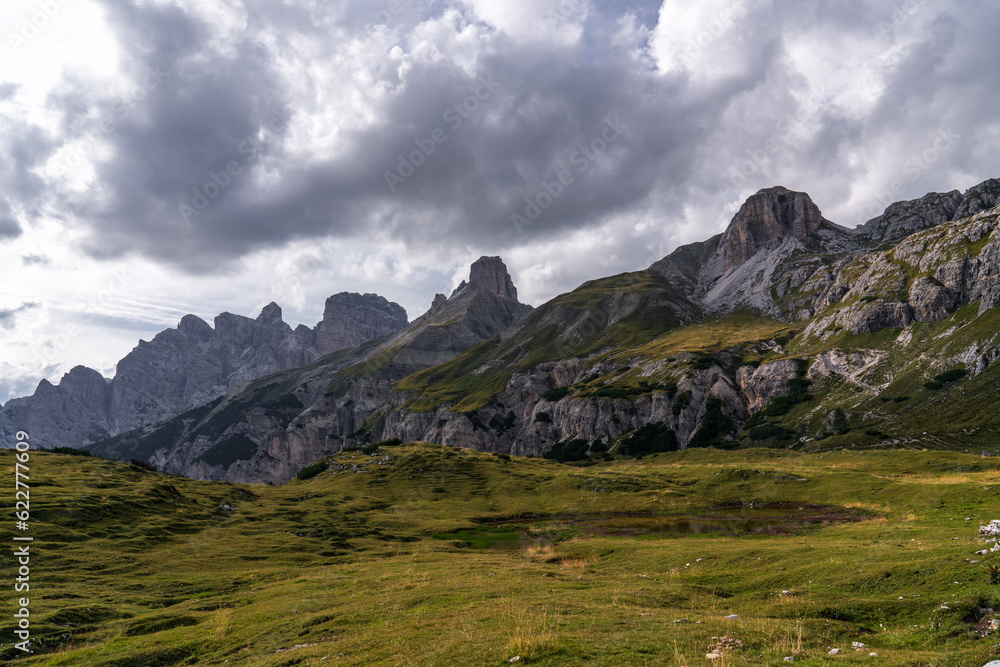 Stunning mountain views. Picturesque landscape with beautiful sharp rocks and dark storm clouds. Beautiful mountain landscape. Dolomites. Italy.