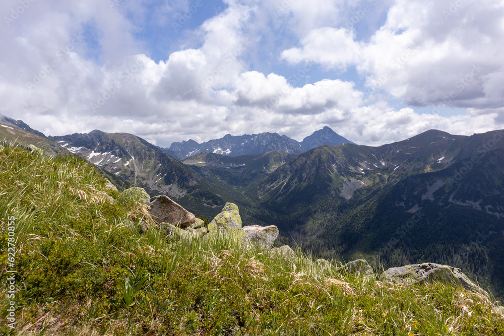 
Natural daytime view of the Polish Tatra Mountains with hiking trails popular with tourists
