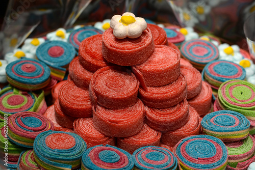 multi-colored candies for sale on a shop window.