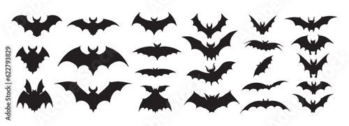 Flying bat with wings doodle set. Collection of hand drawn various black silhouettes of flying bats animals in rows