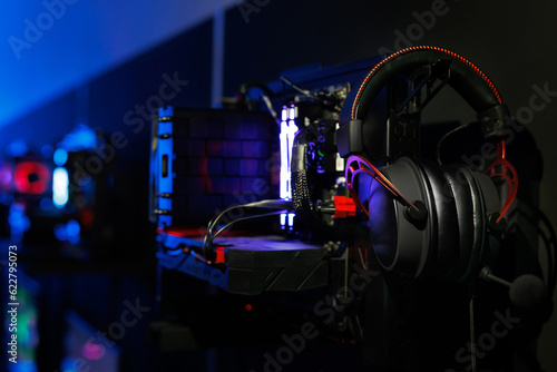 A top-end system unit for a gaming computer in close-up with neon illumination.