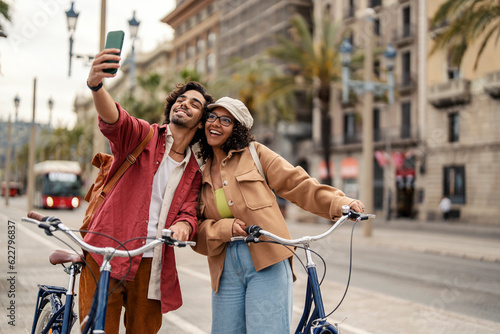 Tourist taking selfie on the city street.