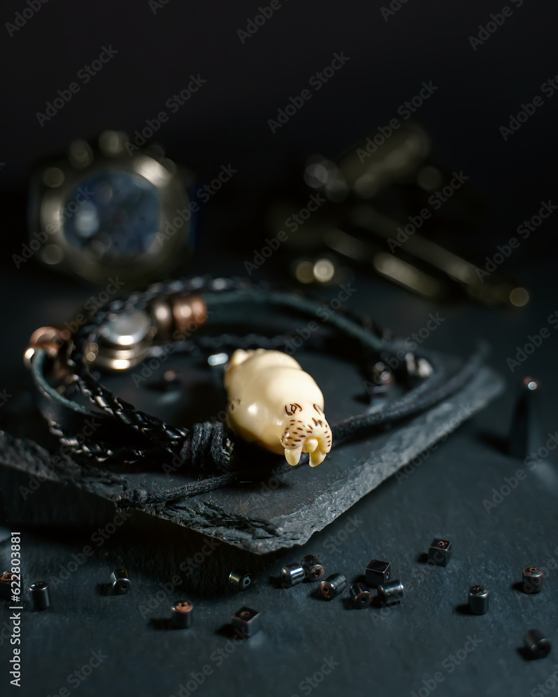 An amulet in the shape of a walrus head made of walrus tusk bone An amulet in the shape of a walrus head made of walrus tusk bone
