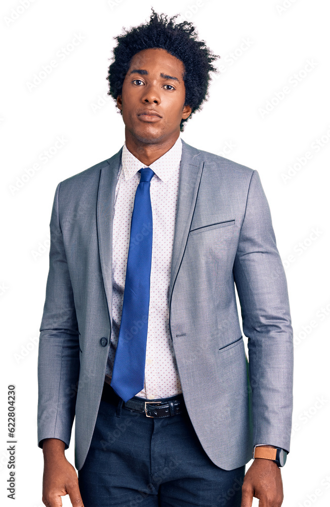Handsome african american man with afro hair wearing business jacket relaxed with serious expression on face. simple and natural looking at the camera. Handsome african american man with afro hair wearing business jacket relaxed with serious expression on face. simple and natural looking at the camera.
