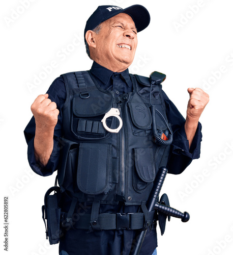 Senior handsome man wearing police uniform very happy and excited doing winner gesture with arms raised, smiling and screaming for success. celebration concept.