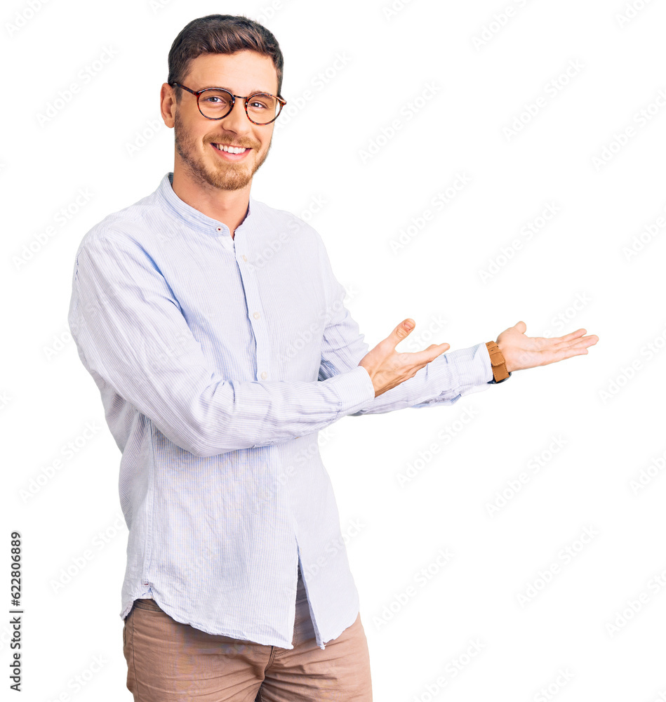 Handsome young man with bear wearing elegant business shirt and glasses inviting to enter smiling natural with open hand Handsome young man with bear wearing elegant business shirt and glasses inviting to enter smiling natural with open hand