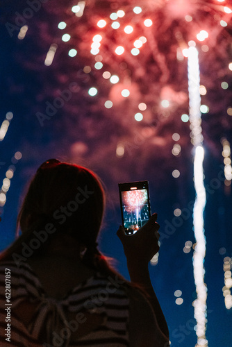 Person Taking Photos of Fireworks on a Phone