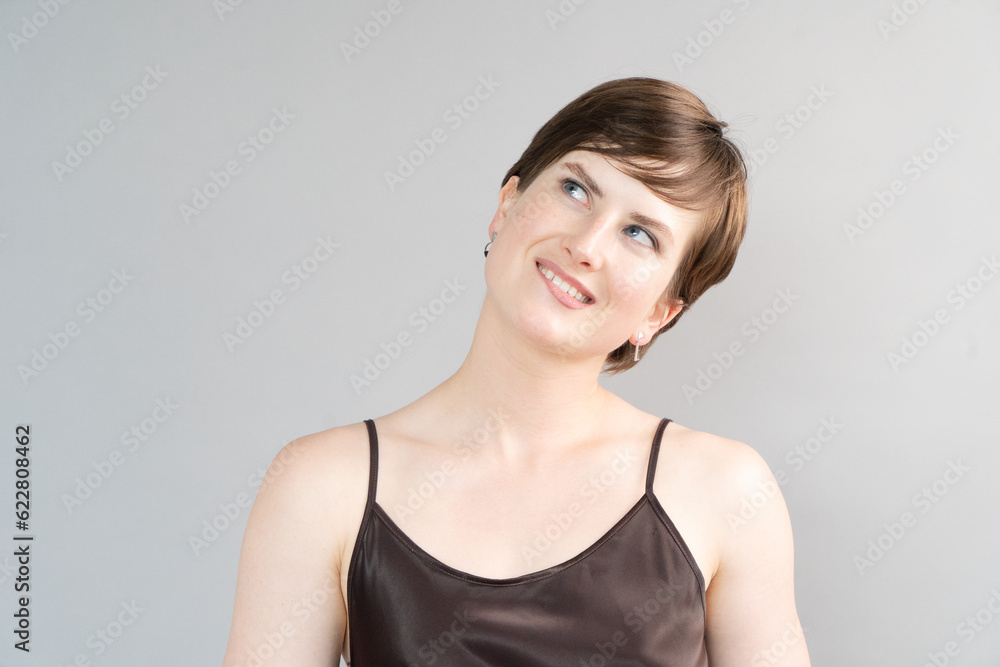 Happy young girl isolated over gray background Happy young girl isolated over gray background