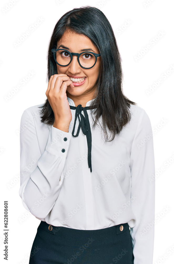 Beautiful asian young woman wearing business shirt and glasses looking stressed and nervous with hands on mouth biting nails. anxiety problem. Beautiful asian young woman wearing business shirt and glasses looking stressed and nervous with hands on mouth biting nails. anxiety problem.