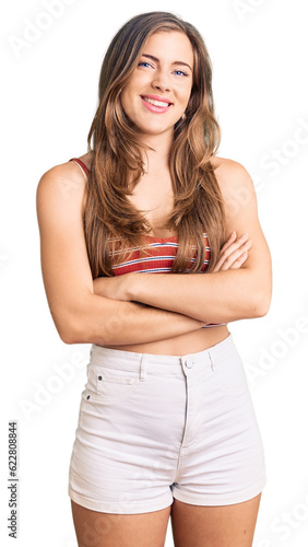 Beautiful caucasian young woman wearing casual clothes happy face smiling with crossed arms looking at the camera. positive person. © Krakenimages.com