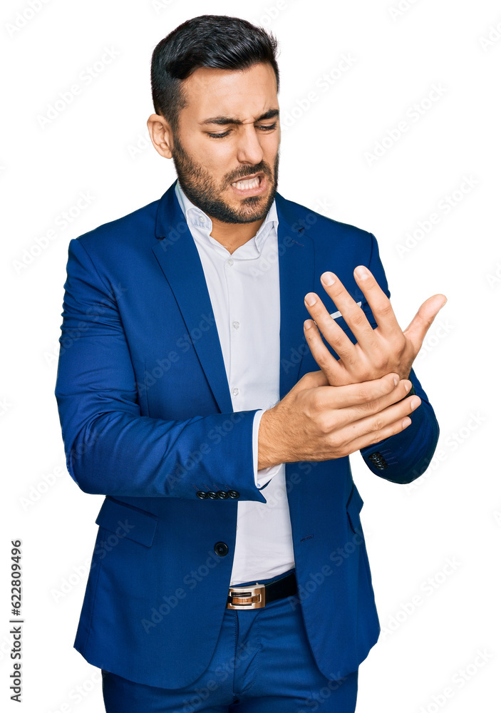 Young hispanic man wearing business jacket suffering pain on hands and fingers, arthritis inflammation Young hispanic man wearing business jacket suffering pain on hands and fingers, arthritis inflammation