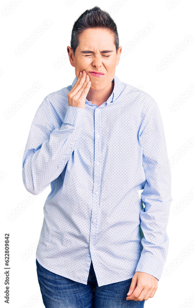 Young woman with short hair wearing business clothes touching mouth with hand with painful expression because of toothache or dental illness on teeth. dentist Young woman with short hair wearing business clothes touching mouth with hand with painful expression because of toothache or dental illness on teeth. dentist