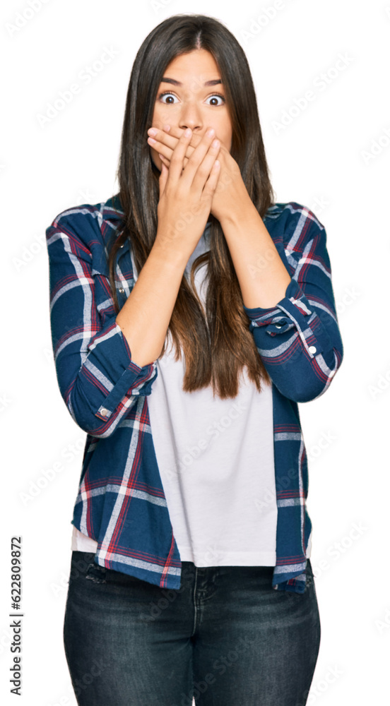Young brunette woman wearing casual clothes shocked covering mouth with hands for mistake. secret concept. Young brunette woman wearing casual clothes shocked covering mouth with hands for mistake. secret concept.