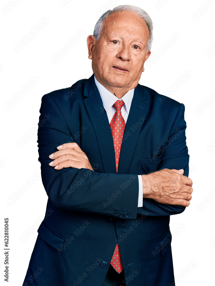Senior business man with grey hair with arms crossed gesture relaxed with serious expression on face. simple and natural looking at the camera. Senior business man with grey hair with arms crossed gesture relaxed with serious expression on face. simple and natural looking at the camera.