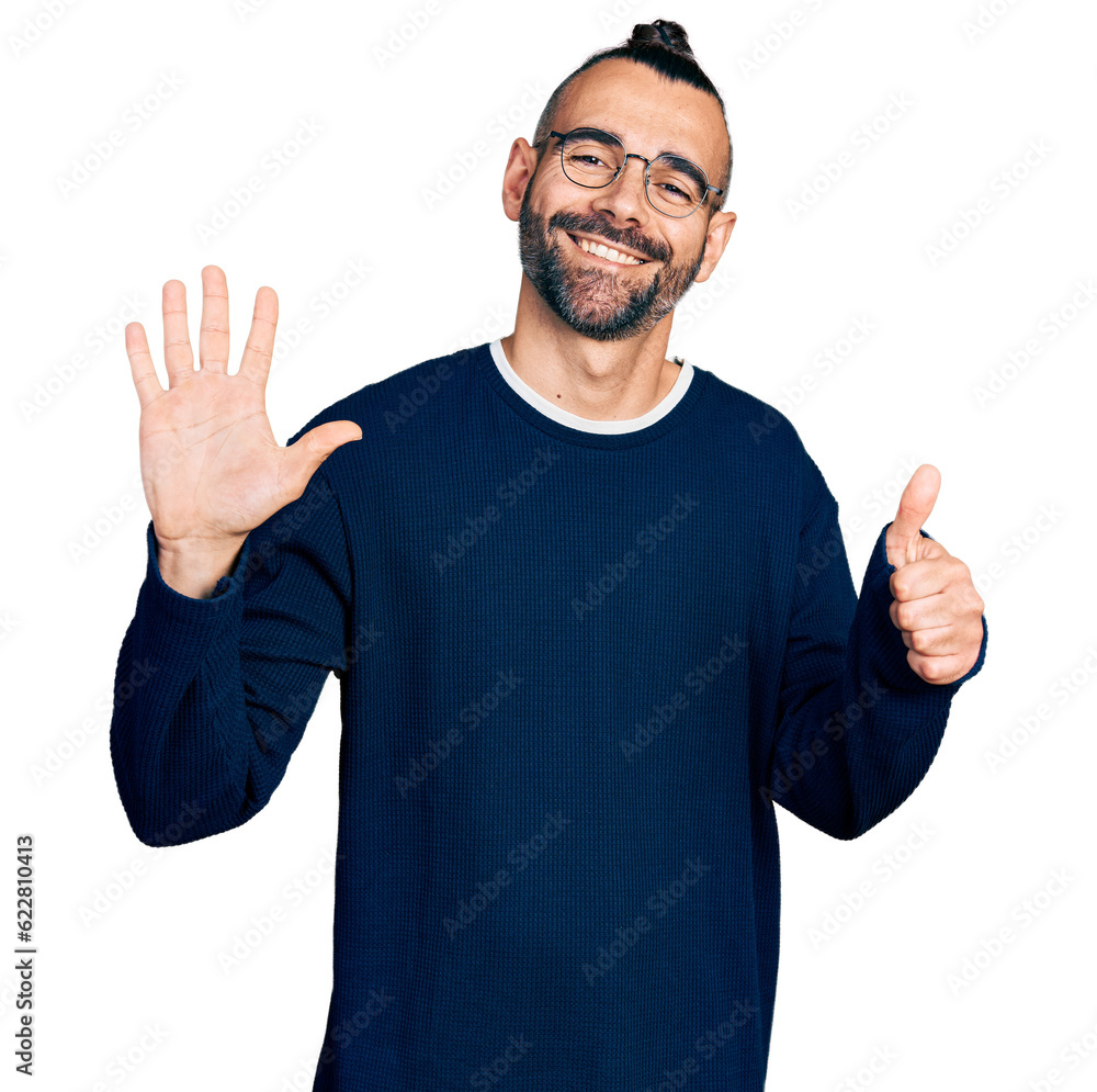 Hispanic man with ponytail wearing casual sweater and glasses showing and pointing up with fingers number six while smiling confident and happy. Hispanic man with ponytail wearing casual sweater and glasses showing and pointing up with fingers number six while smiling confident and happy.