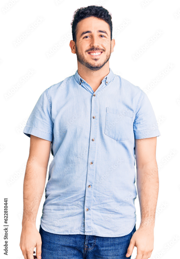 Young hispanic man wearing casual clothes looking positive and happy standing and smiling with a confident smile showing teeth Young hispanic man wearing casual clothes looking positive and happy standing and smiling with a confident smile showing teeth