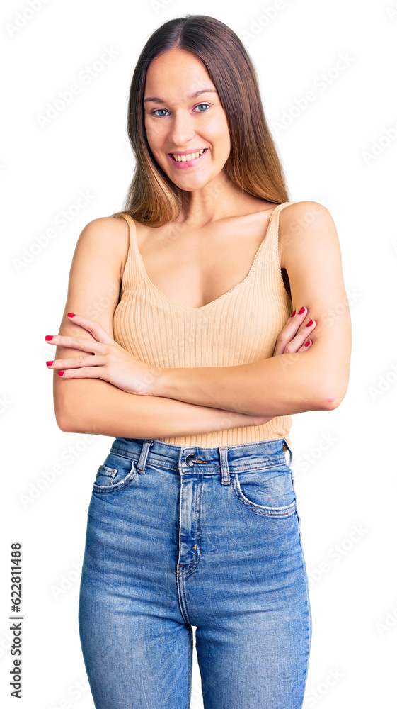 Beautiful brunette young woman wearing casual clothes happy face smiling with crossed arms looking at the camera. positive person. Beautiful brunette young woman wearing casual clothes happy face smiling with crossed arms looking at the camera. positive person.