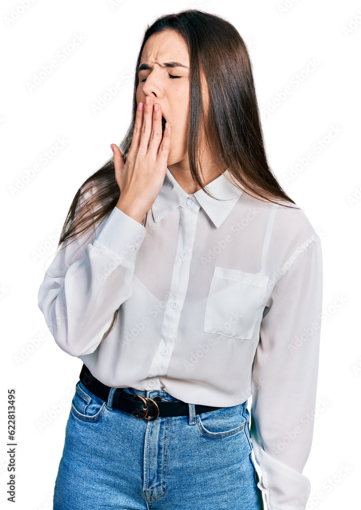 Young brunette teenager wearing business white shirt bored yawning tired covering mouth with hand. restless and sleepiness. Young brunette teenager wearing business white shirt bored yawning tired covering mouth with hand. restless and sleepiness.