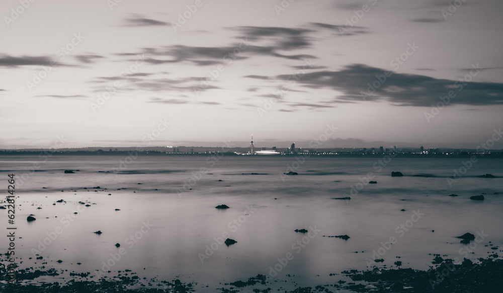A monochrome shot of Portsmouth, UK taken from the Isle of Wight.