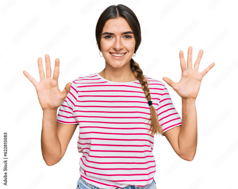 Young hispanic woman wearing casual clothes showing and pointing up with fingers number ten while smiling confident and happy. Young hispanic woman wearing casual clothes showing and pointing up with fingers number ten while smiling confident and happy.