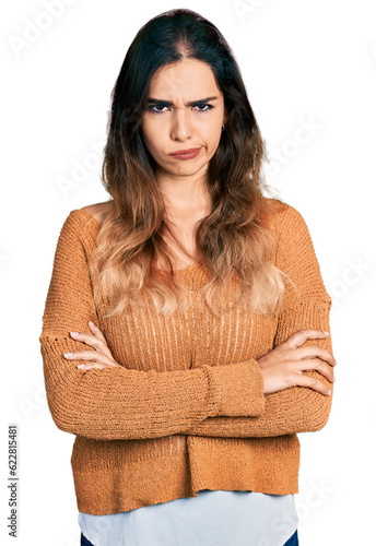 Obraz na plátne Beautiful hispanic woman with arms crossed gesture skeptic and nervous, frowning upset because of problem
