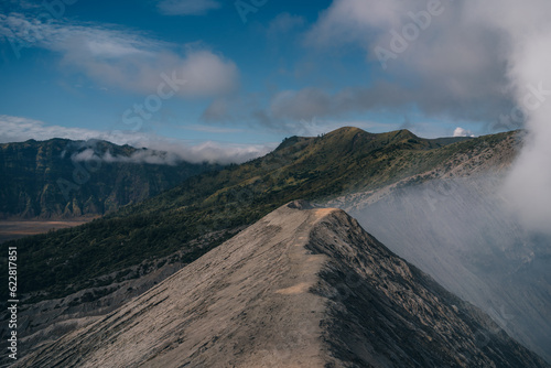 Amazing landscape view of mount Bromo with hiking route. Trekking footpath to viewpoint volcano Bromo