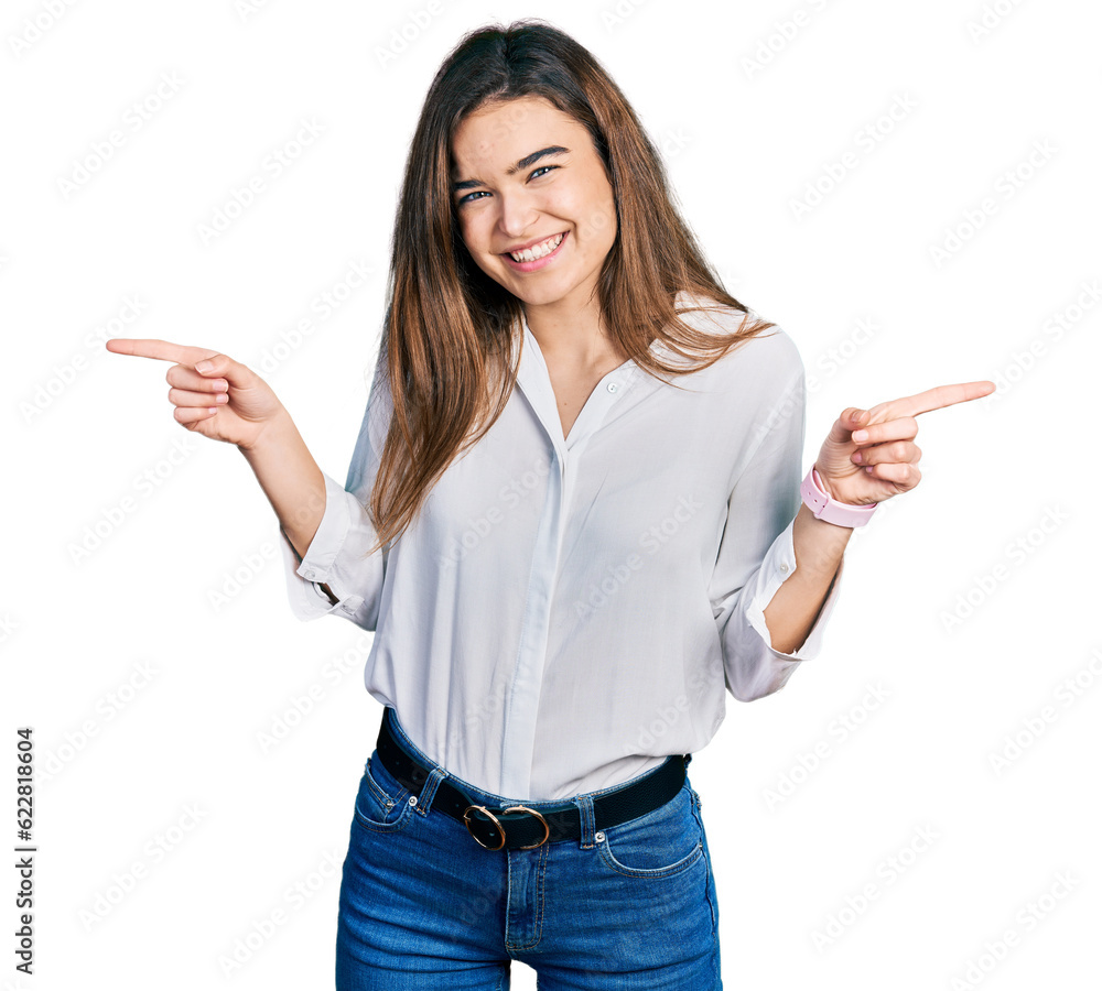 Young caucasian girl wearing casual white shirt smiling confident pointing with fingers to different directions. copy space for advertisement Young caucasian girl wearing casual white shirt smiling confident pointing with fingers to different directions. copy space for advertisement
