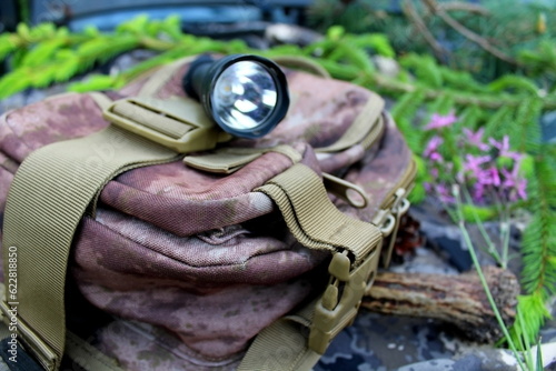 Traveler's and nature lover's accessories on camouflage material