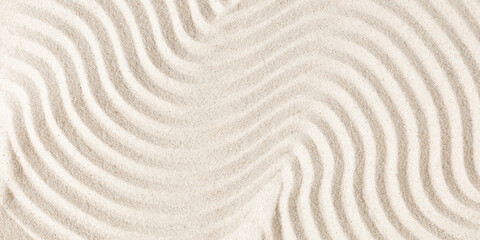 Sand pattern as background. Zen pattern in white sand. Beach sand texture in summer sun.