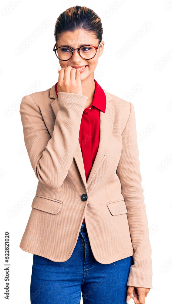 Young beautiful woman wearing business shirt and glasses looking stressed and nervous with hands on mouth biting nails. anxiety problem.