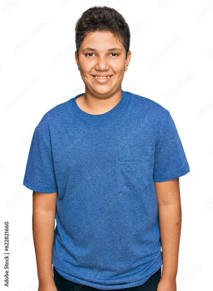 Teenager hispanic boy wearing casual clothes with a happy and cool smile on face. lucky person. Teenager hispanic boy wearing casual clothes with a happy and cool smile on face. lucky person.