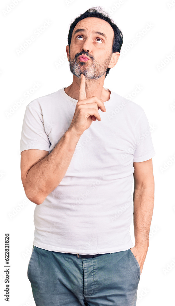 Middle age handsome man wearing casual t-shirt thinking concentrated about doubt with finger on chin and looking up wondering Middle age handsome man wearing casual t-shirt thinking concentrated about doubt with finger on chin and looking up wondering