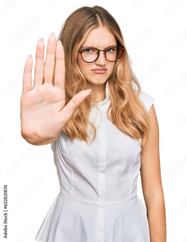Beautiful young caucasian girl wearing casual clothes and glasses doing stop sing with palm of the hand. warning expression with negative and serious gesture on the face. Beautiful young caucasian girl wearing casual clothes and glasses doing stop sing with palm of the hand. warning expression with negative and serious gesture on the face.