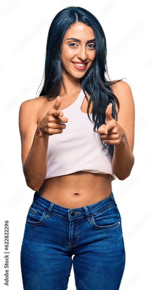 Beautiful hispanic woman wearing casual clothes pointing fingers to camera with happy and funny face. good energy and vibes. Beautiful hispanic woman wearing casual clothes pointing fingers to camera with happy and funny face. good energy and vibes.