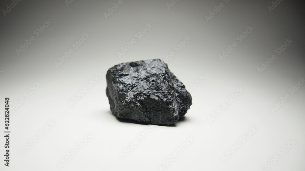 Naklejka premium A black rock also known as Ozokerite