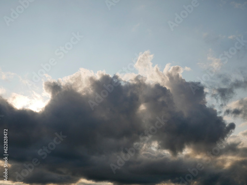 Stormy sky with white and grey clouds background, beautiful sunset heaven photo