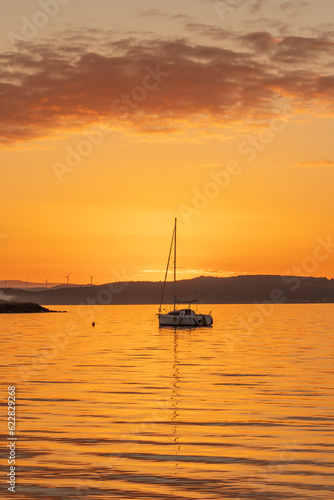 beautiful sunset at the sea with boats