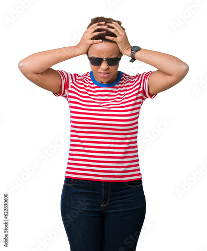 Beautiful young african american woman wearing sunglasses over isolated background suffering from headache desperate and stressed because pain and migraine. Hands on head.