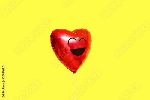 Heart-shaped balloon with d...