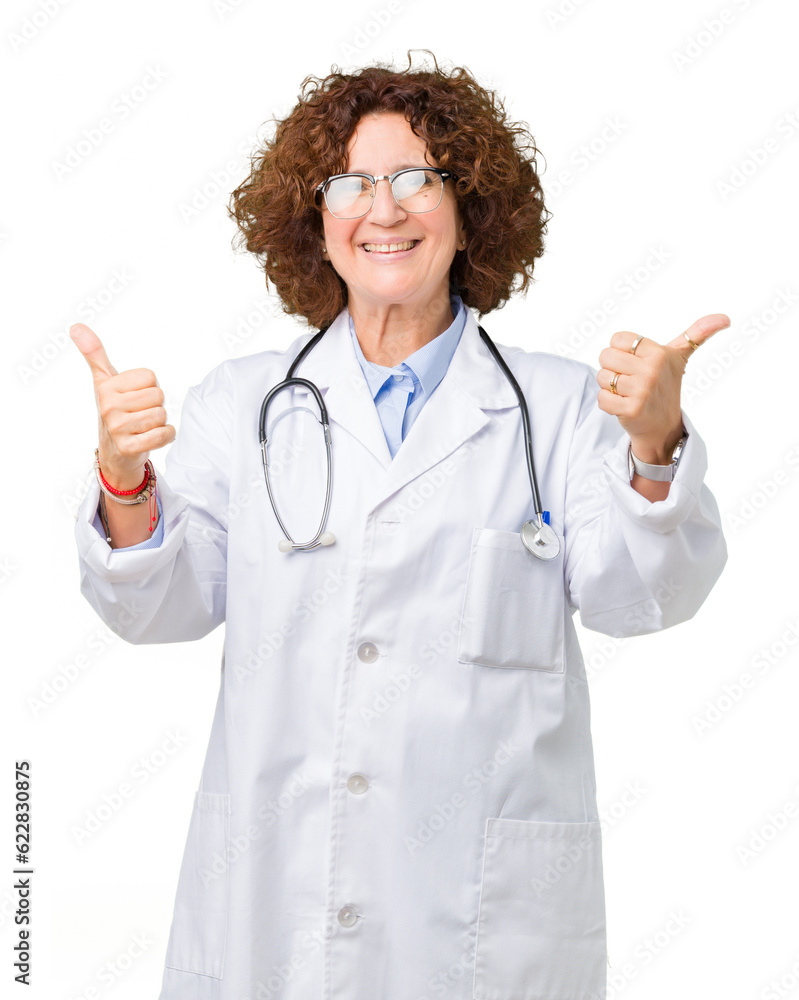 Middle ager senior doctor woman over isolated background success sign doing positive gesture with hand, thumbs up smiling and happy. Looking at the camera with cheerful expression, winner gesture. Middle ager senior doctor woman over isolated background success sign doing positive gesture with hand, thumbs up smiling and happy. Looking at the camera with cheerful expression, winner gesture.