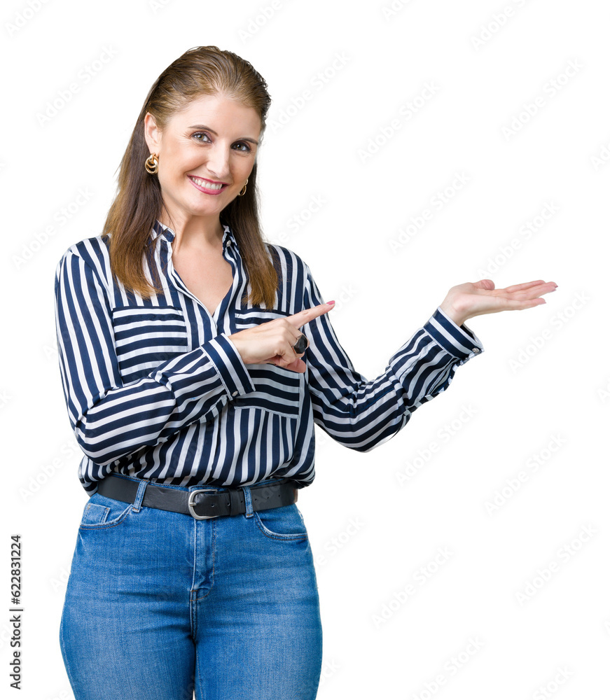Middle age mature business woman over isolated background amazed and smiling to the camera while presenting with hand and pointing with finger. Middle age mature business woman over isolated background amazed and smiling to the camera while presenting with hand and pointing with finger.