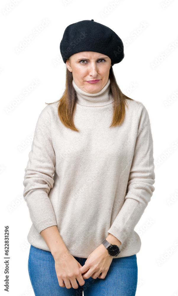 Middle age mature woman wearing winter sweater and beret over isolated background skeptic and nervous, frowning upset because of problem. Negative person. Middle age mature woman wearing winter sweater and beret over isolated background skeptic and nervous, frowning upset because of problem. Negative person.