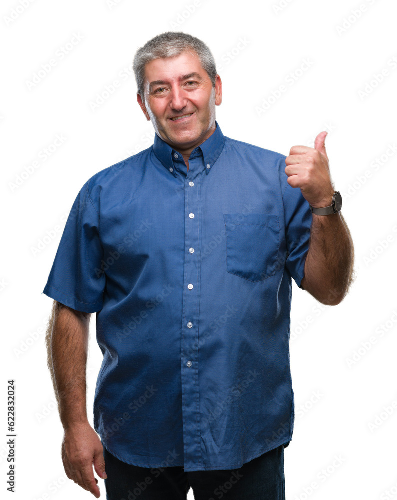 Handsome senior man over isolated background smiling with happy face looking and pointing to the side with thumb up. Handsome senior man over isolated background smiling with happy face looking and pointing to the side with thumb up.